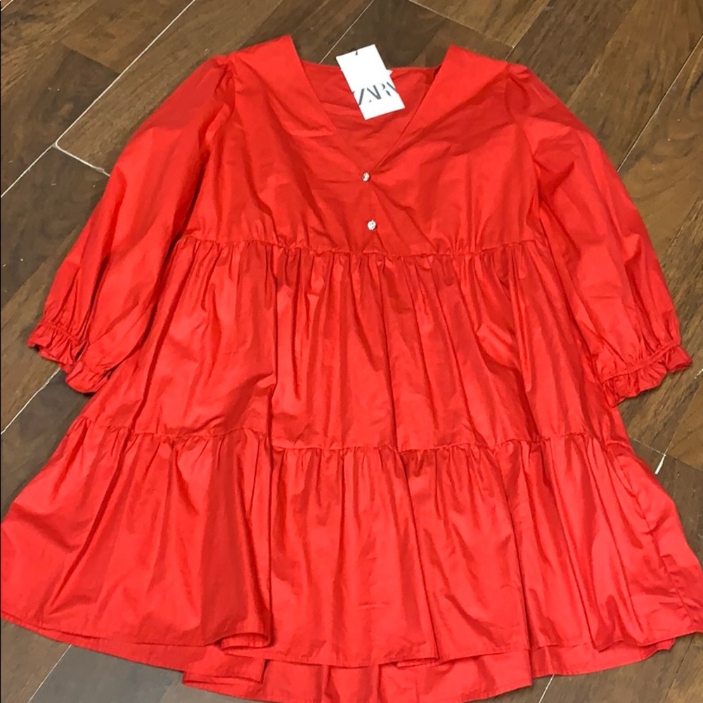 Zara read tunic size medium.